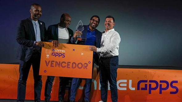 V3Cube leadership team speaking at a business summit in Angola about innovation and digital app solutions